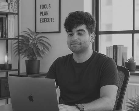 Aryaman doing research through his laptop