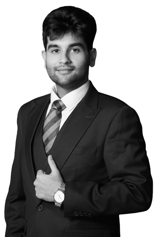 Mr Aryaman in black and white, wearing a suit and a tie, professional pose.
